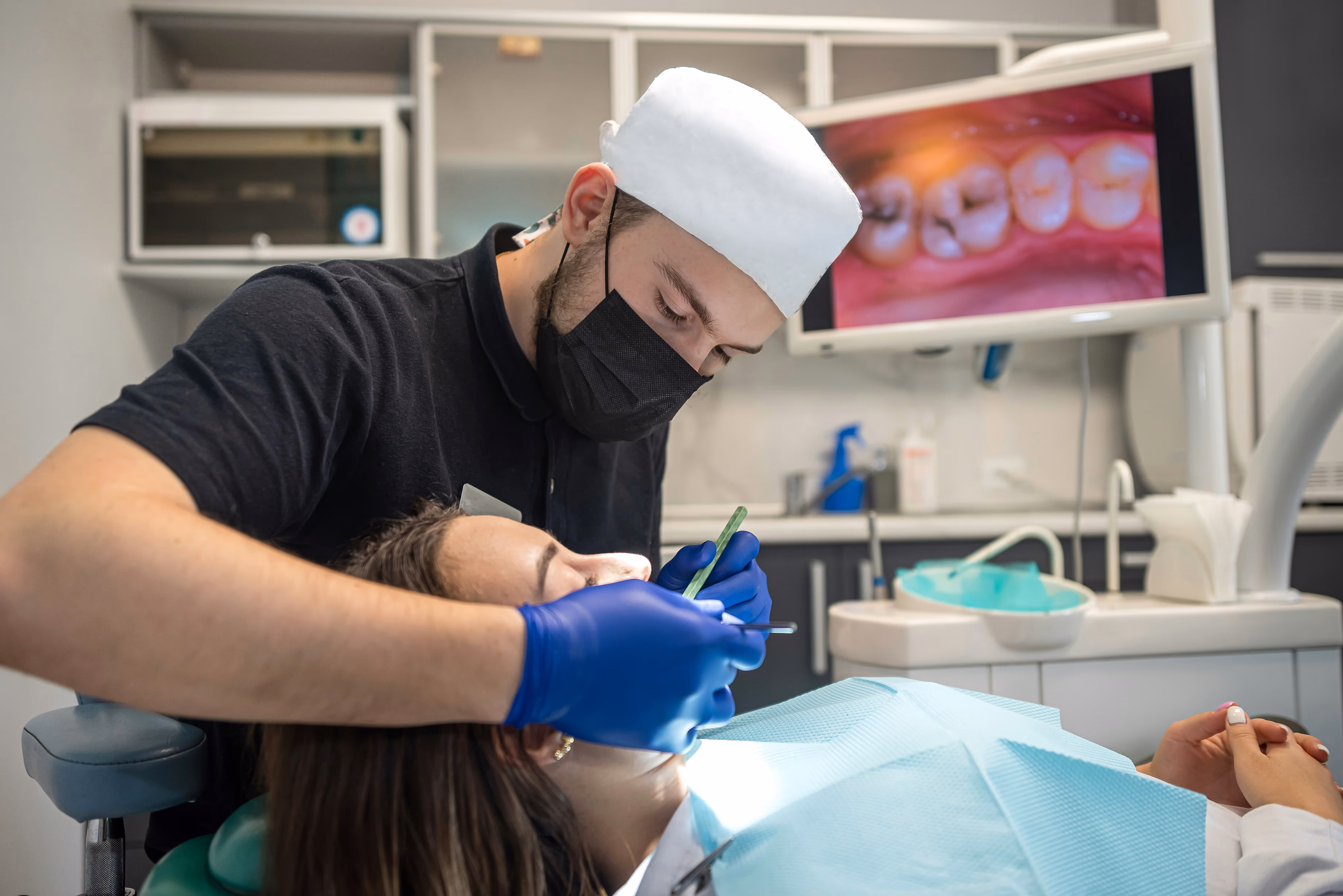 Dentist carefully working on patient's teeth